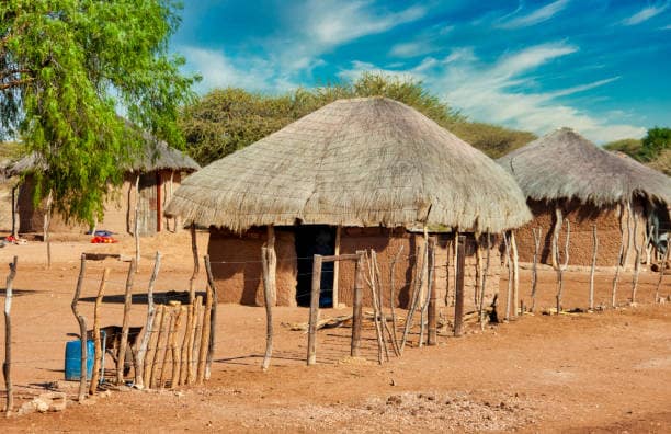 African huts in Old Kachikau Village in Botswana